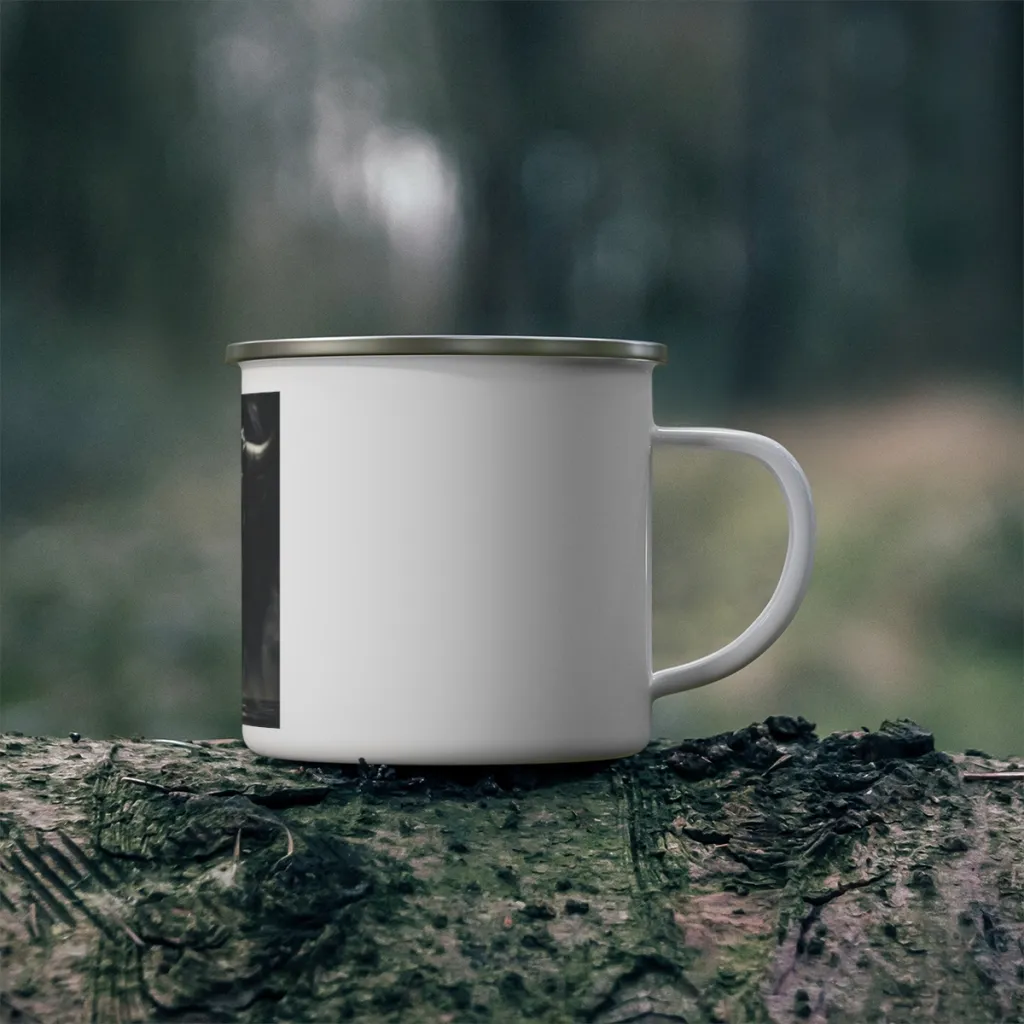 Enamel camping mug with a silver coin under low light and a gold bull standing in the dark behind it