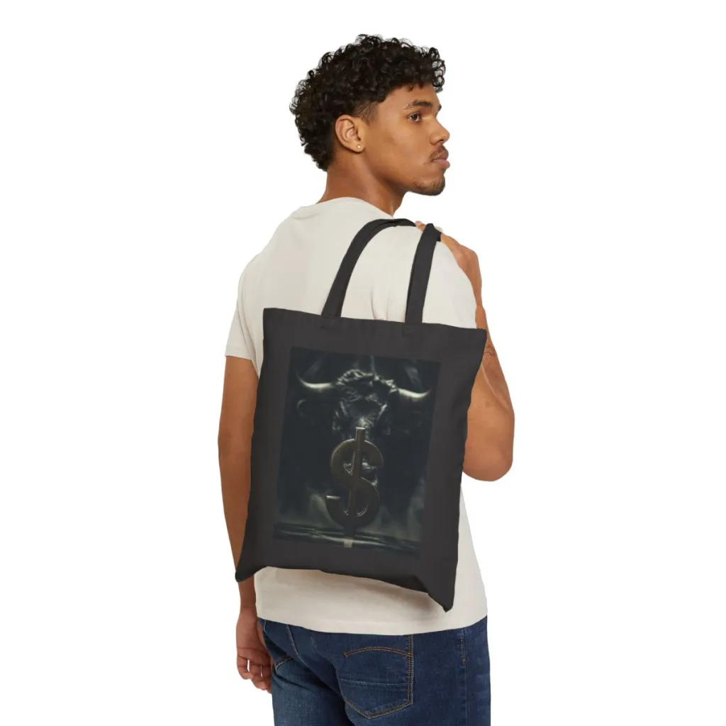 Cotton canvas tote bag showing a silver coin under dim light with a golden bull rising behind it